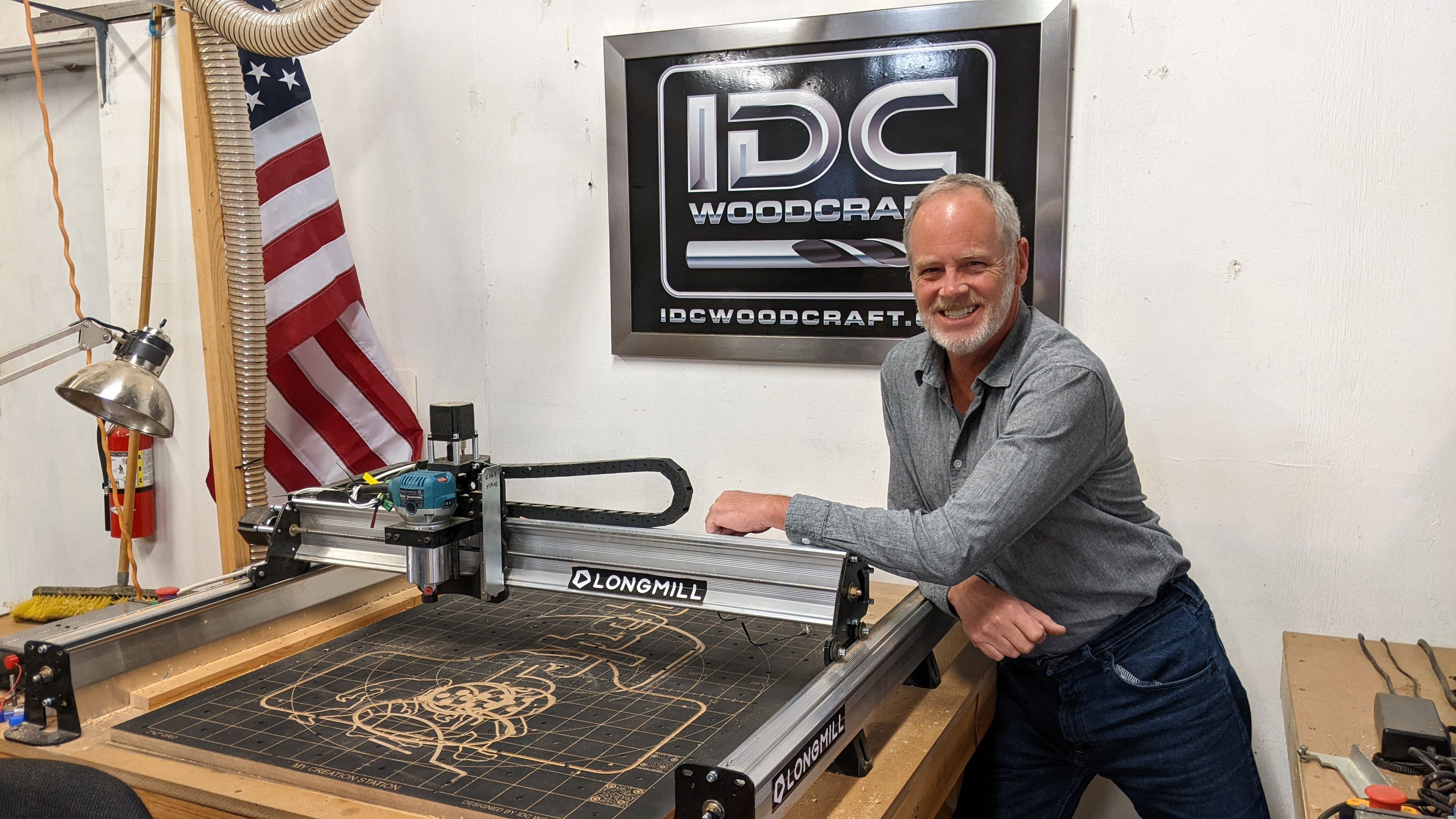 Garrett Fromme standing next to Longmill CNC Router