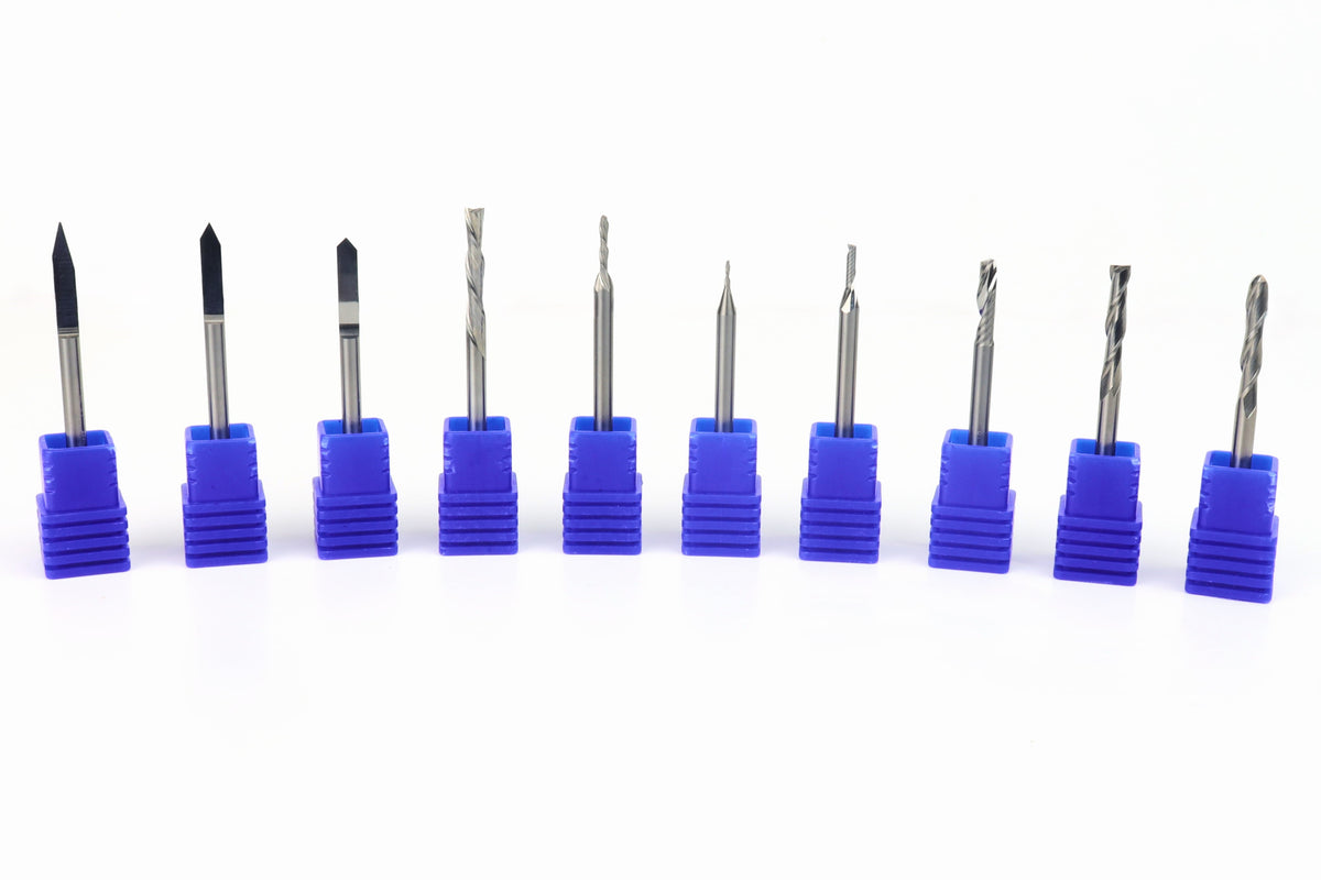 A set of 1/8 shank CNC router bits arranged in a line, each bit in a blue holder with different shapes and sizes visible, representing various cutting edges suitable for CNC woodworking.